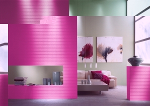 Ein Zimmer mit der Innenraumfarbe von Sto in pink und grün